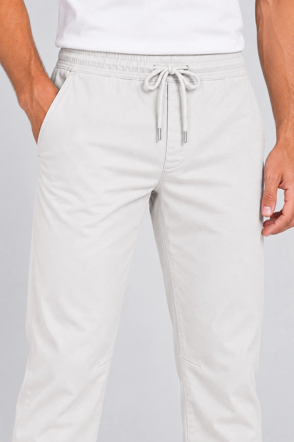 Pantalon de golf homme ivoire, cordon de serrage à la taille, poches latérales.