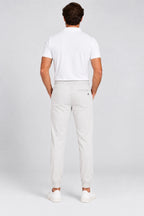 Pantalon de golf homme ivoire, vue de dos avec taille élastique et cordon.