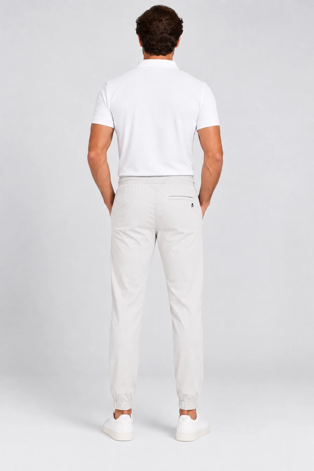 Pantalon de golf homme ivoire, vue de dos avec taille élastique et cordon.