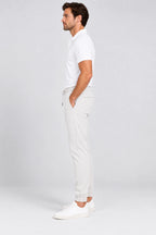 Pantalon de golf homme ivoire, coupe jogging, cordon à la taille, ourlet resserré.