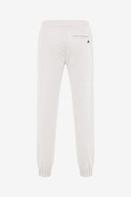 Pantalon de golf homme ivoire, taille élastique, bas resserré, logo discret.