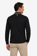 Polo manches longues noir, vue dos, col à liserés rouge et blanc.