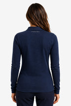 Polo manches longues femme bleu marine, vue arrière, manches longues et coupe cintrée.