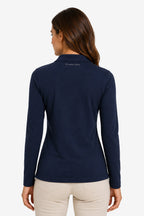 Polo de golf femme manches longues bleu marine, vue de dos, coupe près du corps.