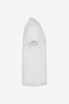 Polo de golf blanc en coton pour fille, manches courtes, col boutonné.