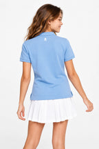 Polo fille bleu ciel coton, dos avec petit logo, col boutonné, manches courtes