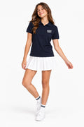 Polo fille en coton bleu marine, col rabattu, petite broderie poitrine.