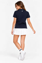 Polo fille bleu marine en coton, manches courtes, logo au dos.