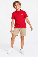 Polo enfant rouge en coton, col et patte boutonnée, logo brodé sur la poitrine