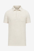 Polo de golf pour homme beige clair uni, col boutonné, poche poitrine, manches courtes.