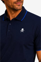 Polo bleu marine à col contrasté, logo tête de mort brodé, manches courtes