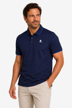 Polo de golf homme gaufré stretch bleu marine, col polo, logo crâne sur la poitrine