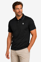Polo de golf homme gaufré stretch noir, col polo boutonné, logo crâne sur la poitrine