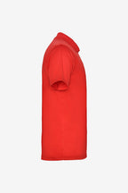 Polo technique golf fille rouge, col boutonné, manches courtes, vue de côté.