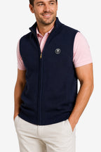 Gilet golf zippé sans manches bleu marine, fermeture éclair dorée, logo poitrine.