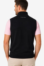 Gilet golf zippé sans manches noir à l’arrière, bord côte bas, logo dos.