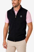 Gilet golf zippé sans manches noir, bord côte bas, logo poitrine.