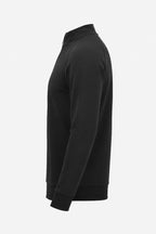 Pull golf technique homme noir, vue 3/4 côté, tissu uni et col montant
