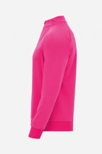 Pull golf technique homme rose fuchsia, vue 3/4 côté, col montant fermé
