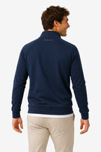 Pull de golf technique homme bleu marine, vue de dos, col droit, finitions côtelées.