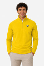 Pull homme jaune à demi-zip, logo poitrine ronde et col montant.
