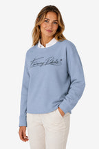 Sweat-shirt de golf pour femme ample bleu ciel, logo poitrine au trait et col cheminée.