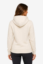 Sweat-shirt à capuche beige femme, vue de dos, cordons et couture centrale.