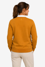 Sweat de golf pour femme orange, dos uni avec petit logo brodé en haut.
