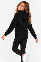 Sweat de golf pour fille noir à capuche, vue arrière en mouvement