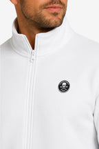 Détail veste de golf zippée homme en molleton blanc : fermeture éclair et écusson poitrine.