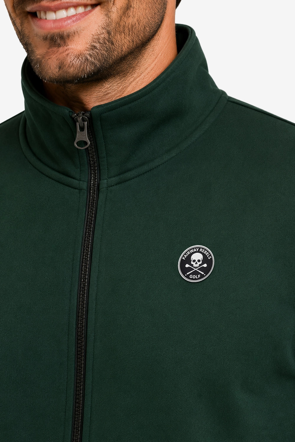 Veste de golf verte foncée, fermeture zippée et badge logo sur la poitrine.