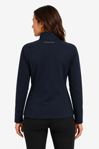 Veste de golf déperlante femme bleu marine, fermeture zippée et col montant.