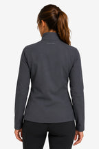 Veste de golf déperlante pour femme gris graphite vue de dos, col montant, coupe près du corps.