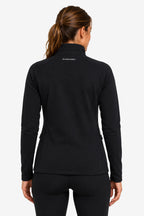 Veste de golf déperlante pour femme noire vue de dos, col montant, zips latéraux discrets.