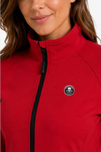 Veste de golf déperlante rouge : zip noir, col montant et écusson