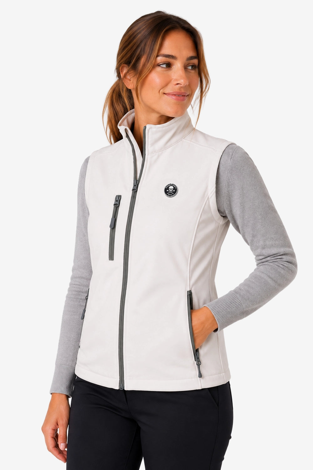 Veste golf femme sans manches déperlante blanche, zip central et poches zippées latérales.