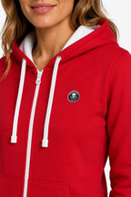 Veste zippée rouge femme à capuche, cordons blancs et petit écusson poitrine.