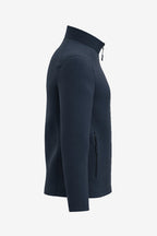 Veste de golf déperlante bleu marine pour homme, vue de profil, manche longue, poche zippée.