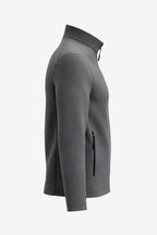 Veste de golf déperlante grise pour homme, vue de profil, manches longues, poche zippée.