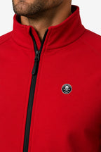 Veste de golf déperlante rouge, col montant et zip noir, logo poitrine.
