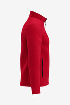 Veste de golf déperlante rouge pour homme, vue côté manche, poche zippée au bras.