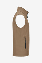 Veste golf sans manches déperlante beige, vue de profil avec poche zippée verticale.