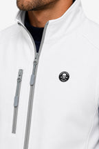 Veste golf sans manches déperlante blanche, détail zip argent et écusson rond sur le cœur.