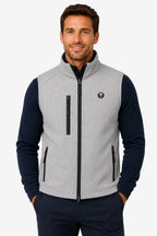 Gilet de golf sans manches déperlant gris clair, col montant, fermeture zippée et poches.