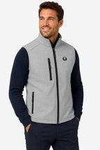 Gilet de golf sans manches déperlant gris clair, col montant, logo et zip central.