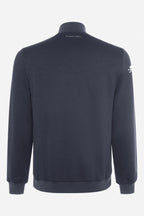 Veste de golf bleu marine, vue de dos, col montant et poignets côtelés